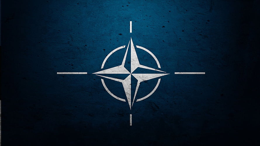 NATO Four-Pointed Star Emblem on Dark Textured Blue Background HD wallpaper