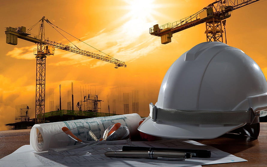 Construction Site Safety Concept with Hard Hat and Blueprints at Sunset HD wallpaper