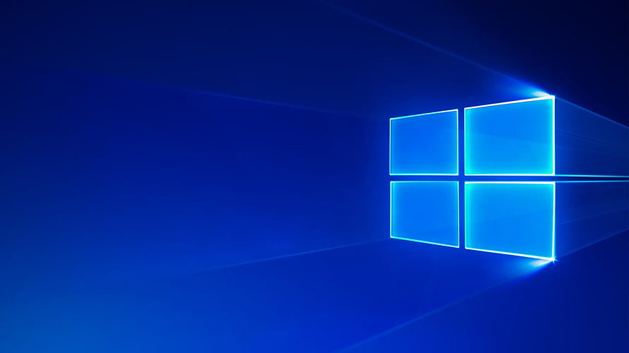Windows 10 Default Blue Desktop Background with Glowing Four-Pane Logo HD wallpaper