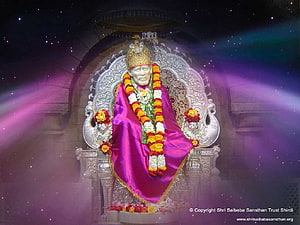 Sai Baba Seated on Ornate Silver Throne with Maroon Robe and Flower Garland HD wallpaper