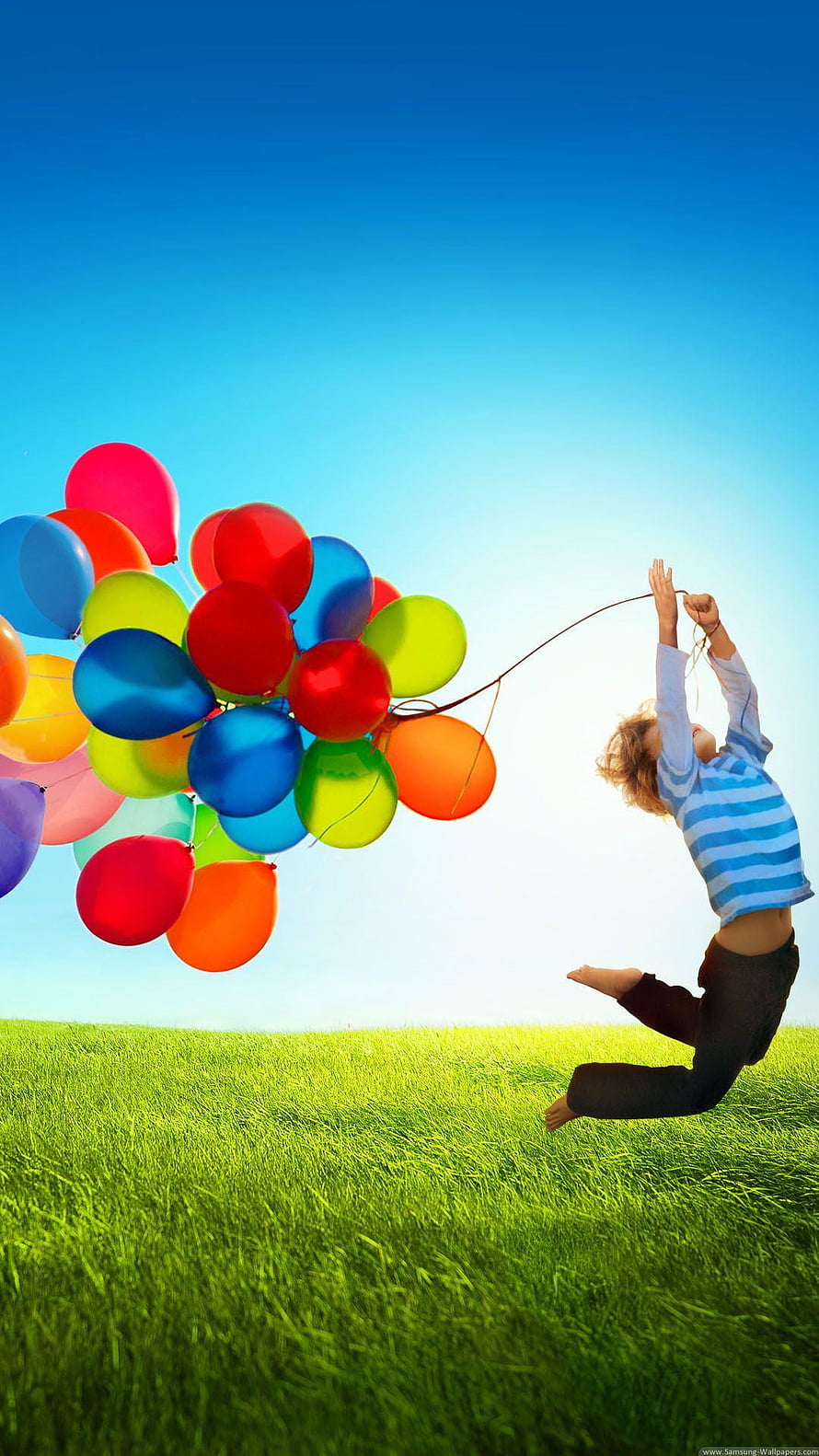 Child Leaping in Green Field Holding Vibrant Balloon Cluster Against Blue Sky HD phone wallpaper