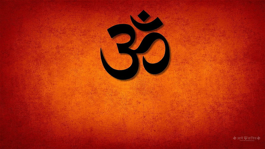 Sacred Om Symbol on Textured Orange Background for Spiritual Meditation HD wallpaper