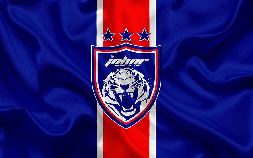 Johor Darul Ta'zim FC Crest on Flowing Blue Silk Fabric with Red and White Vertical Stripe HD wallpaper