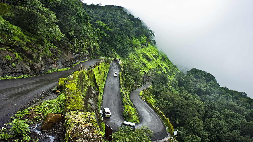 Winding Mountain Road Through Lush Green Hills in India HD wallpaper