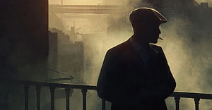 Peaky Blinders Silhouette on Balcony Amidst Industrial Smoke and Hazy Dawn Light HD wallpaper