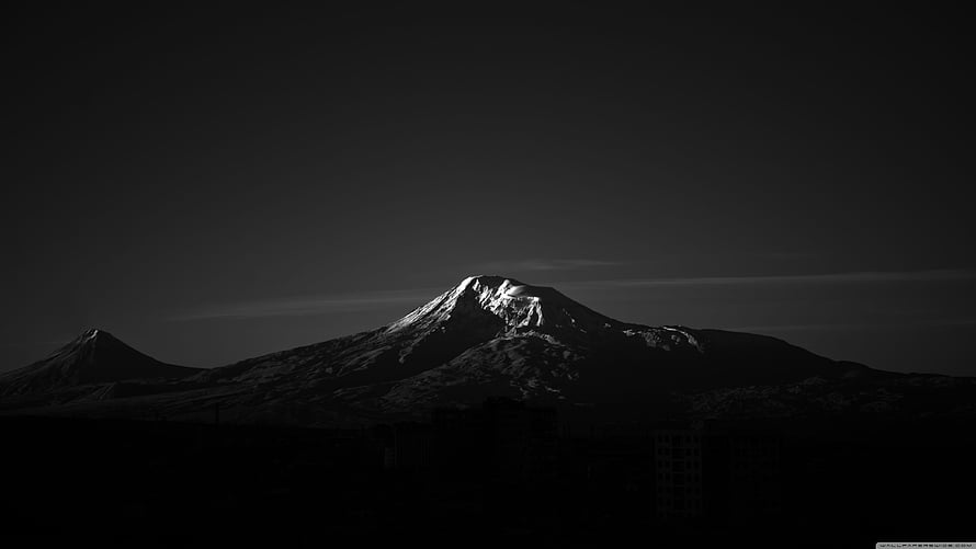 Dramatic Black and White Snow-Capped Mountain Peak at Dusk HD wallpaper