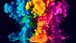 Vibrant Multicolored Ink Clouds Diffusing in Dark Water HD wallpaper