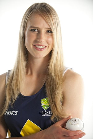 Ellyse Perry in Cricket Australia jersey holding a white cricket ball HD phone wallpaper