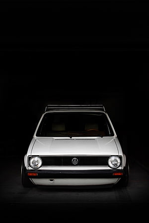 Classic White Volkswagen Golf Mk1 Front View Against Dark Studio Background HD phone wallpaper