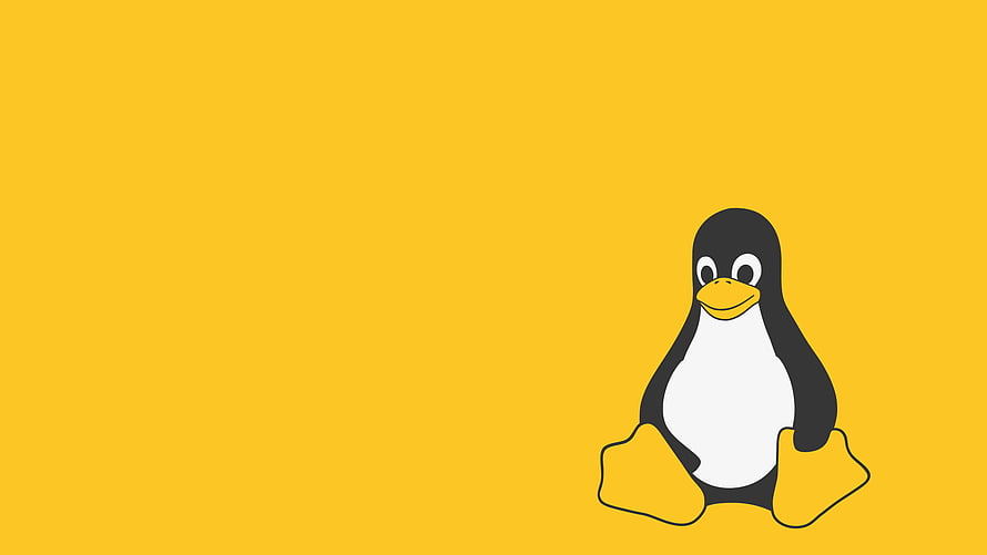 Tux the Linux Penguin Mascot on a Solid Yellow Background HD wallpaper