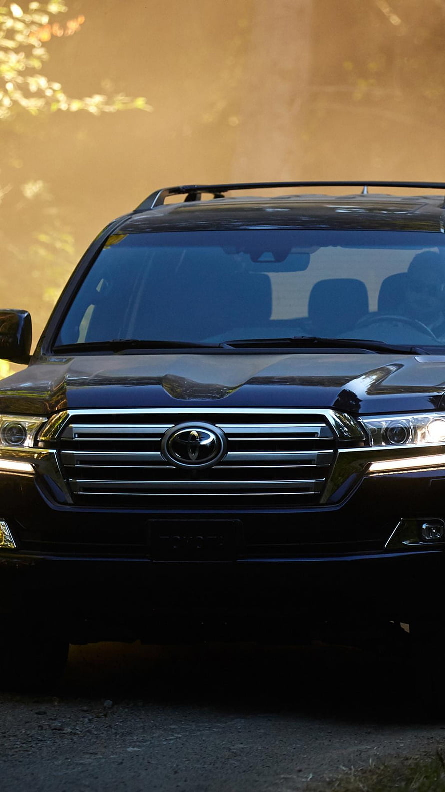 Black Toyota Land Cruiser Front Grille Close-Up in Golden Hour Light HD phone wallpaper