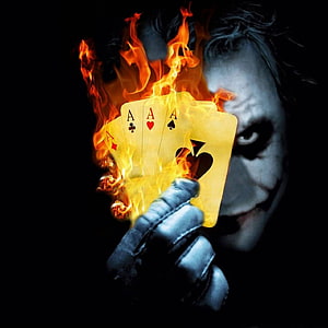 Joker Holding Burning Ace Playing Cards in Dark Cinematic Style HD phone wallpaper