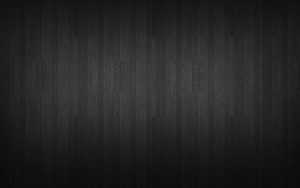 Dark Charcoal Wood Plank Texture with Subtle Grain and Vignette for Minimalist Design HD wallpaper