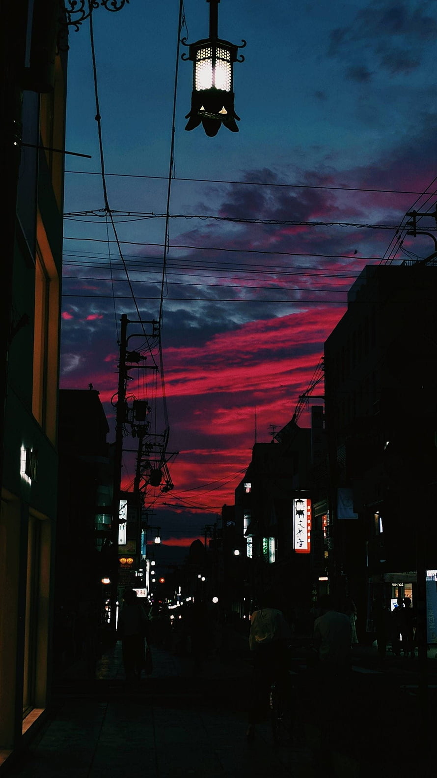 Vivid Crimson Sunset Over Nara Japan Street with Silhouetted Lantern and Power Lines HD phone wallpaper