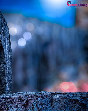 Moody Stone Wall with Bokeh Lights and Blue Sky HD phone wallpaper