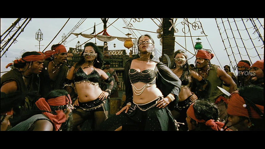Anushka Shetty in a dramatic pirate ship dance scene with crew members HD wallpaper