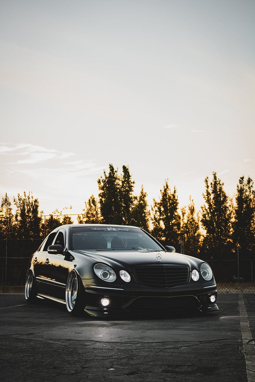 Black Mercedes-Benz W211 E-Class Sedan with Stance Setup at Sunset HD phone wallpaper