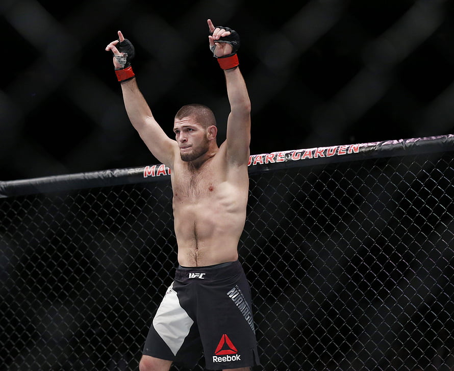 Khabib Nurmagomedov Celebrating Victory Inside the UFC Octagon Cage HD wallpaper