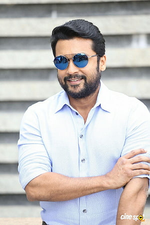 Suriya Sivakumar in Light Blue Shirt and Blue Aviator Sunglasses HD phone wallpaper