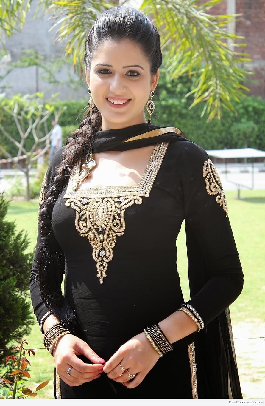 Elegant Woman in Black and Gold Embroidered Traditional Outfit HD phone wallpaper