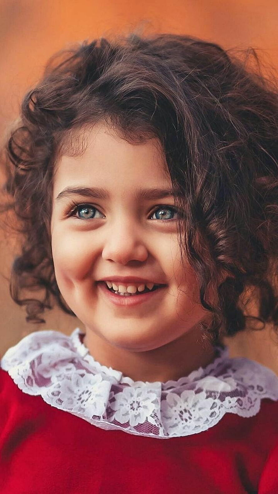 Smiling Curly-Haired Girl in Red Dress with White Lace Collar HD phone wallpaper