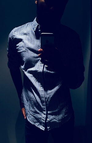 Moody Male Portrait in Striped Shirt Taking a Mirror Selfie HD phone wallpaper