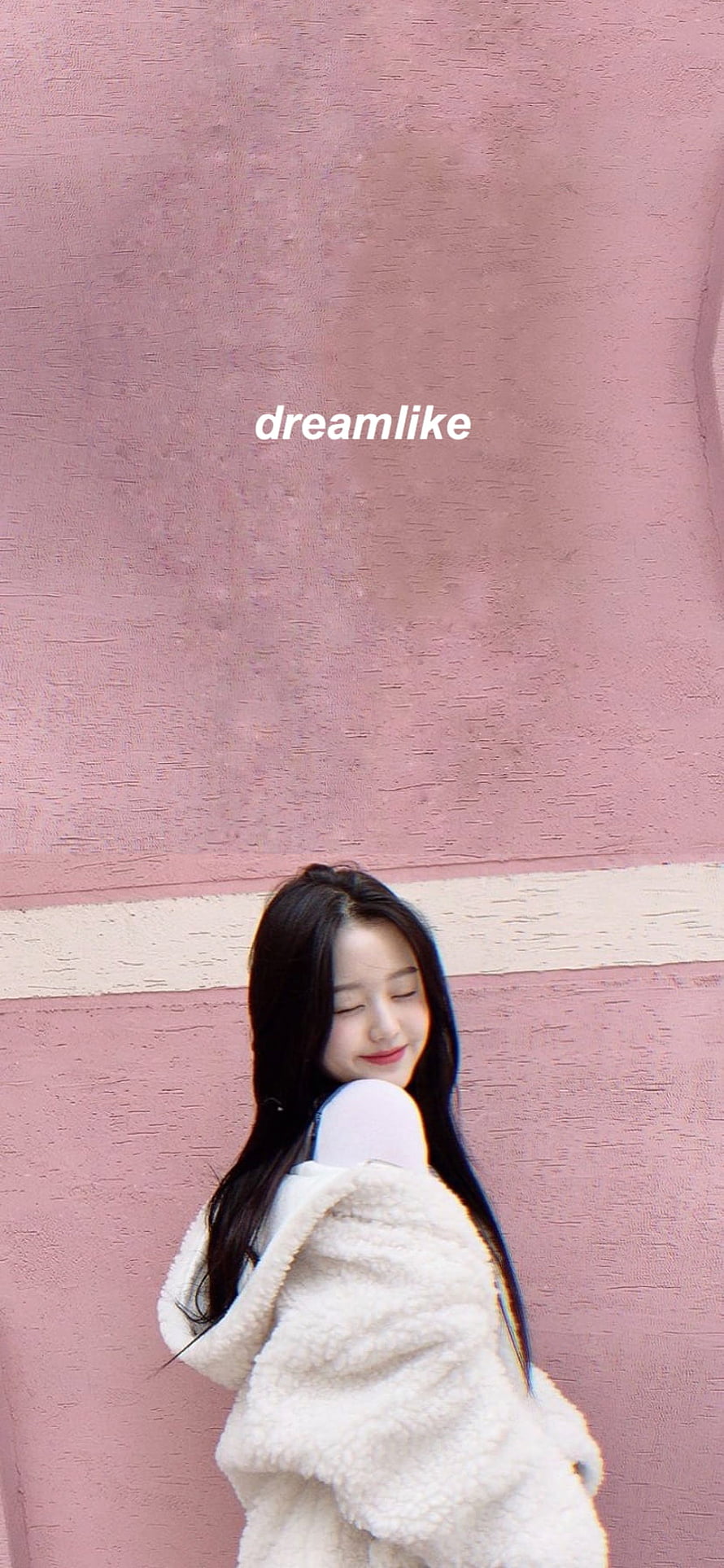 Jang Wonyoung in a cream fleece jacket against a soft pink wall with a dreamlike aesthetic HD phone wallpaper