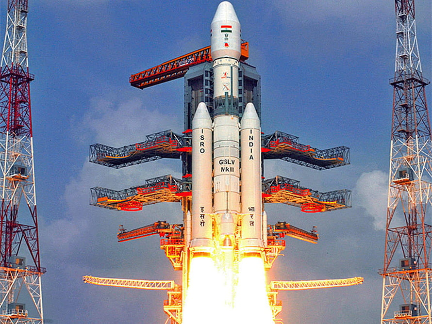 ISRO GSLV Mk III rocket launch with bright engine exhaust and launch tower HD wallpaper