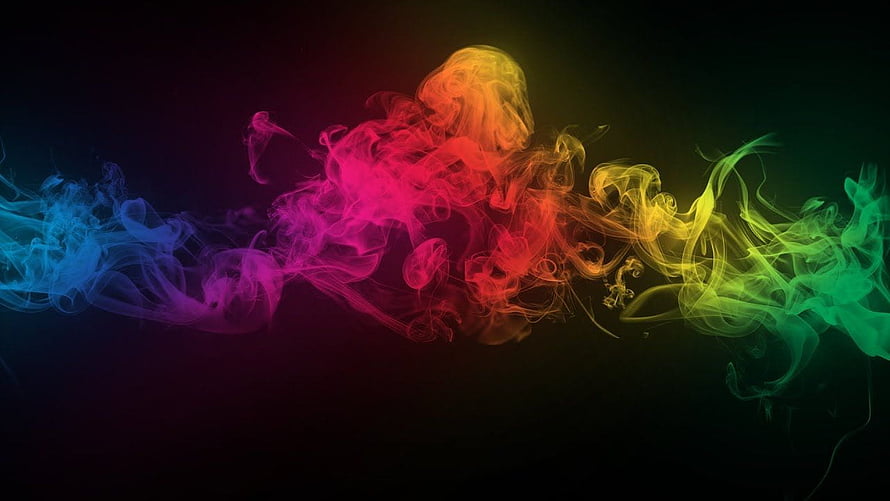 Vibrant Rainbow Smoke Plumes Swirling Against a Dark Background HD wallpaper