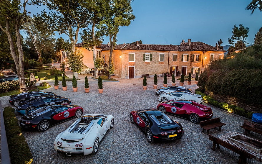 Exotic Supercars Parked in a Historic European Villa Courtyard at Dusk HD wallpaper