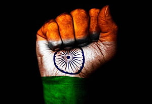 Fist Painted With Indian Tricolor Flag And Ashoka Chakra On Black Background HD wallpaper