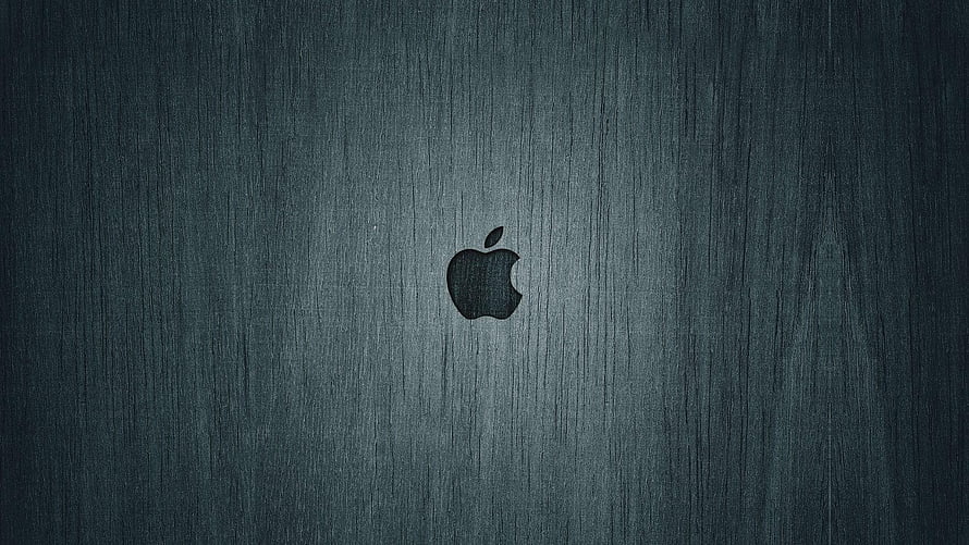 Apple Logo on Dark Brushed Metal Surface with Minimalist Industrial Texture HD wallpaper