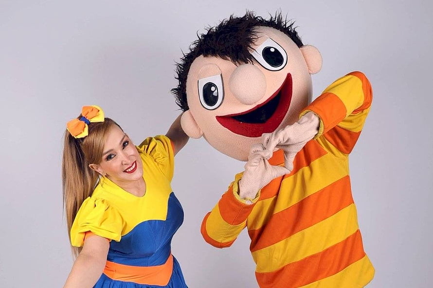 Bely y Beto Mascot and Performer Making a Heart Gesture in Colorful Costumes HD wallpaper