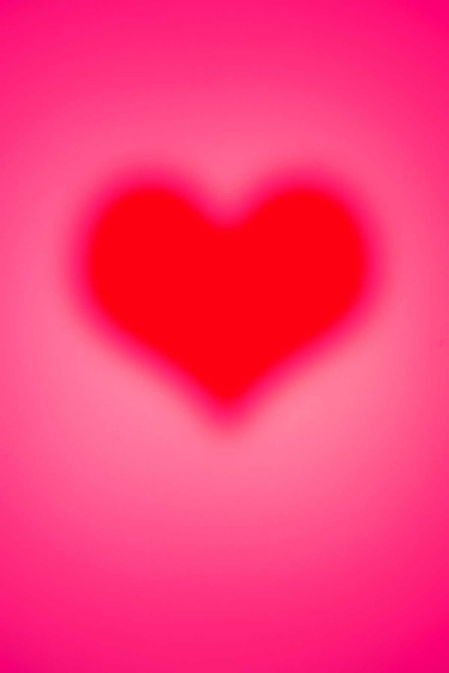 Soft Focus Red Heart on Vibrant Pink Gradient Background HD phone wallpaper