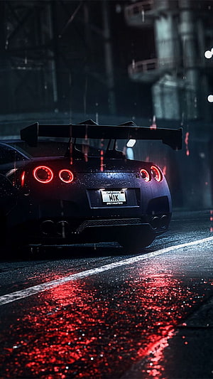 Nissan GT-R R35 Rear View on Wet Night Street with Red Taillight Reflections HD phone wallpaper