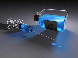Blue Medical Syringe and Vial with O4 Label on Dark Surface HD wallpaper