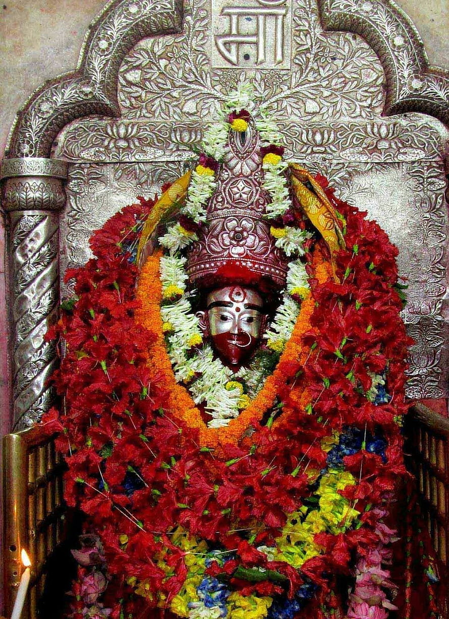 Maa Tara Deity Adorned With Vibrant Flower Garlands In Ornate Silver Shrine HD phone wallpaper
