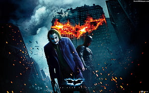 The Dark Knight movie poster featuring The Joker and Batman in a burning cityscape HD wallpaper