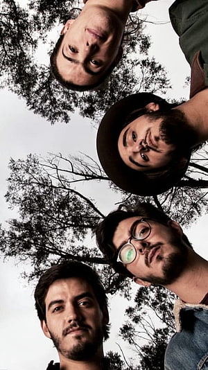 Morat Band Members Looking Down From Above With Trees And Sky Background HD phone wallpaper