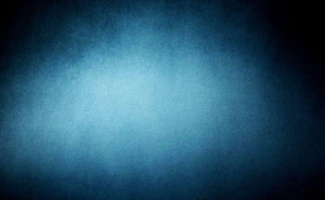 Dark Blue Gradient Studio Backdrop with Soft Central Glow and Vignette HD wallpaper