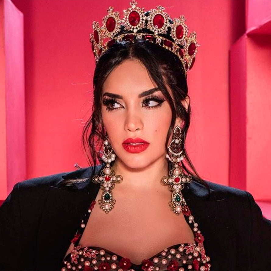 Kimberly Loaiza Wearing Ruby Crown and Ornate Jewelry Against Pink Background HD phone wallpaper