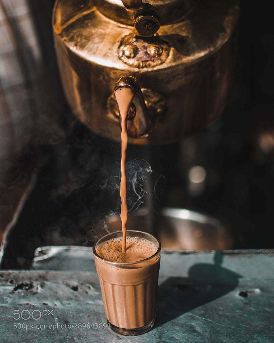 Traditional Indian Chai Pouring From Brass Samovar Into Glass Cup HD phone wallpaper