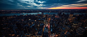 Aerial View of New York City Skyline at Dusk with Dramatic Sunset Clouds HD wallpaper