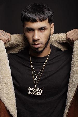 Deza Portrait in Black Tee and Shearling Jacket with Gold Cross Necklace HD phone wallpaper
