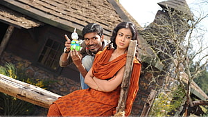 Dhanush and Actress in Kutty Movie Scene with Rustic Village Backdrop HD wallpaper