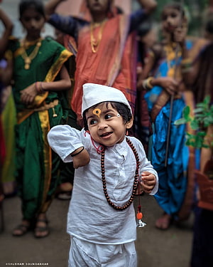 Young Varkari Devotee in White Attire with Rudraksha Mala and Tilak HD phone wallpaper