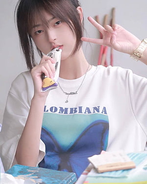 Justina Xie Aesthetic Portrait Wearing White Butterfly Graphic Tee HD phone wallpaper