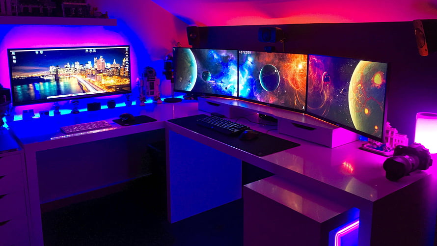 Vibrant RGB Gaming Setup With Curved Ultrawide Monitors And Neon Ambient Lighting HD wallpaper