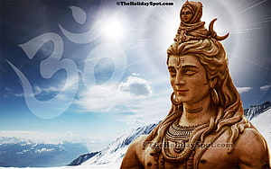 Lord Shiva statue with Om symbol against a backdrop of snow-capped mountains and a bright sun HD wallpaper