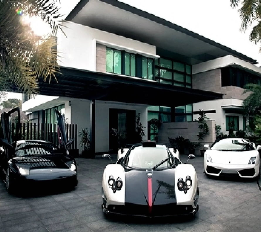 Luxury Supercar Collection Parked in Front of Modern Villa HD wallpaper